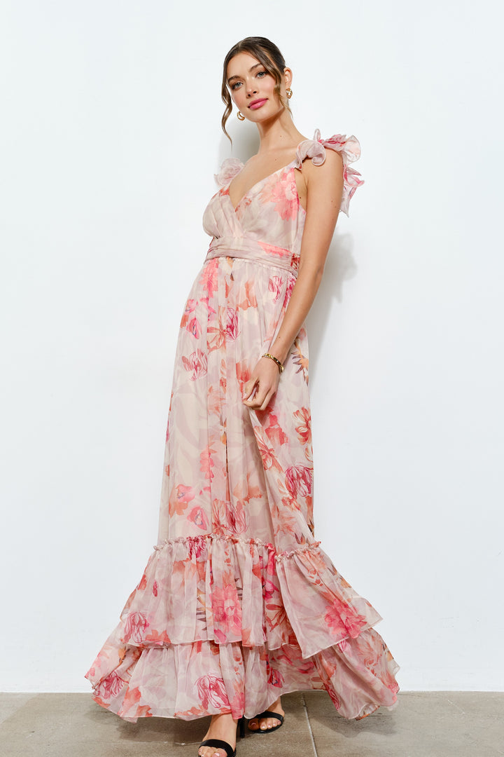 Woman wearing a floral dress against a white background