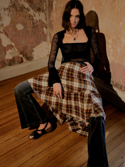 Be a boho dream wearing Marcelline Maxi Skirt. Its high-low silhouette, asymmetric ruffles, and unfinished hem create a flattering and unique style. Crafted from comfortable Viscose-Poly-Elastane, it'll keep you looking and feeling your best! Make a statement and stand out in this simply stunning plaid skirt.