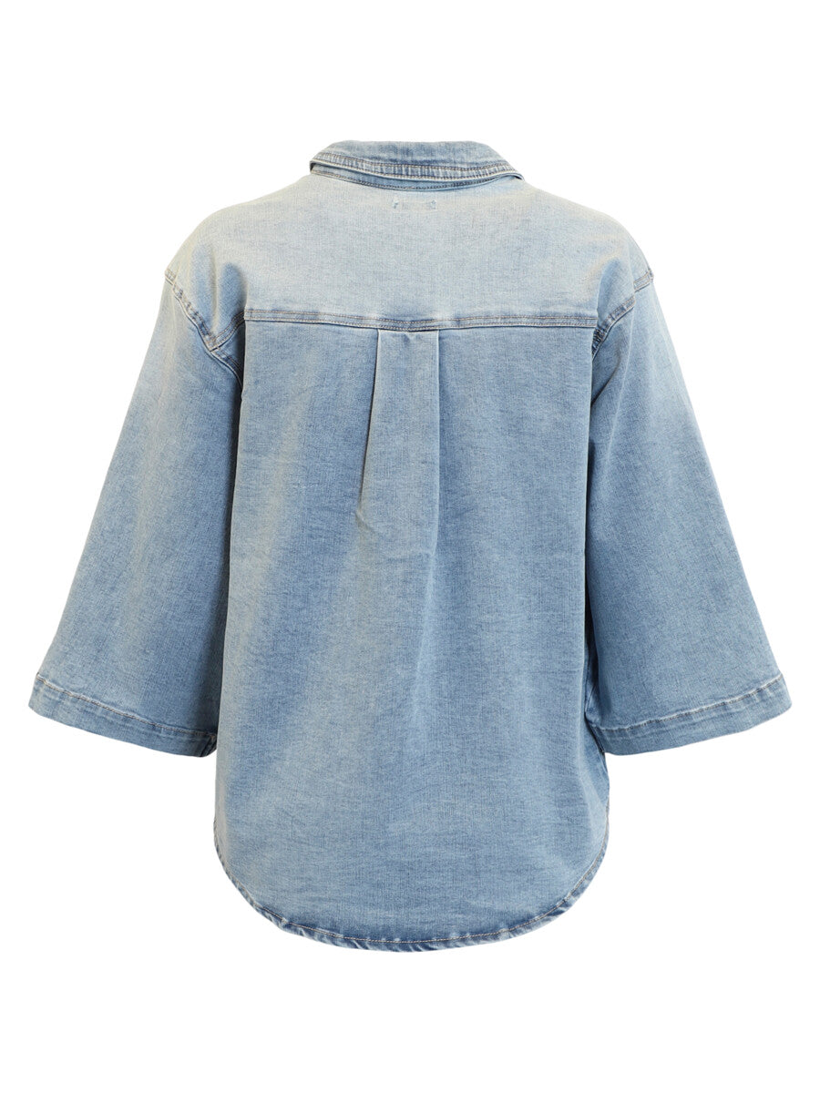 Light blue denim shirt on a white background