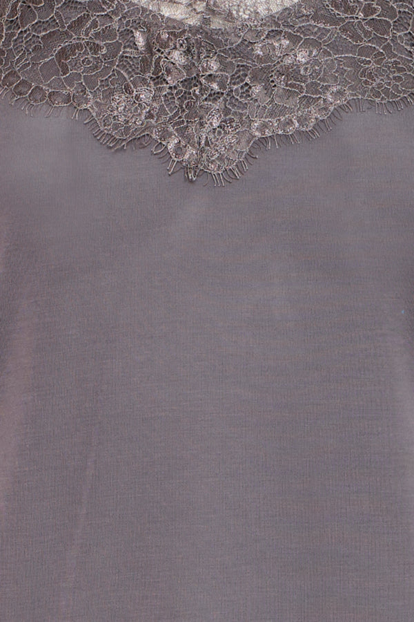 Gray fabric with lace trim at the top