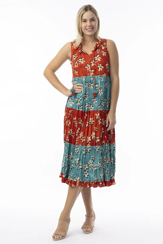 Woman wearing a red and blue patterned dress on a white background