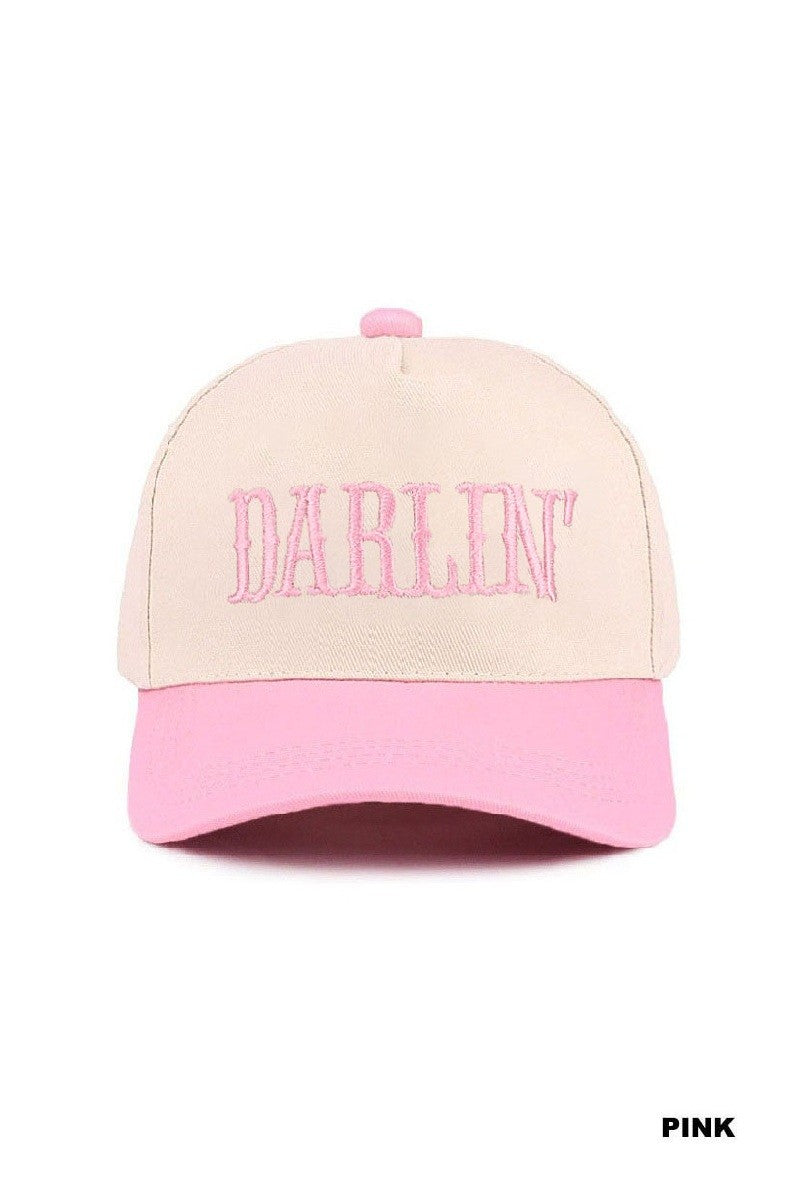 Pink and beige cap with 'Darlin' embroidery on a white background