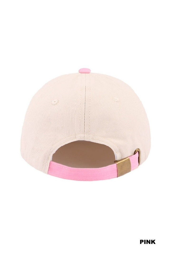 Beige cap with pink and brown accents on a white background