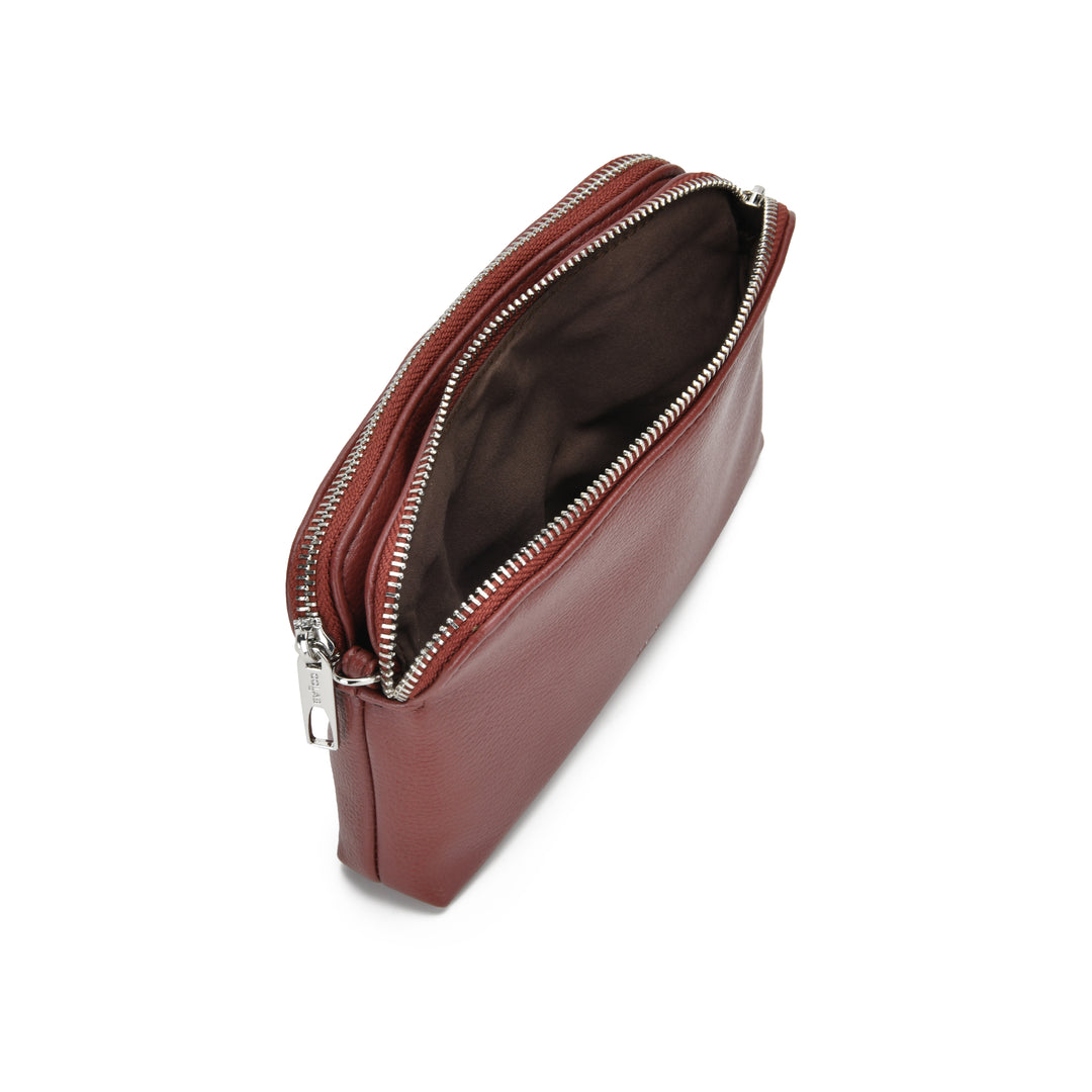 A reddish-brown leather zippered pouch shown open from an overhead angle, revealing a dark brown interior and silver-tone zipper hardware, on a plain white background.