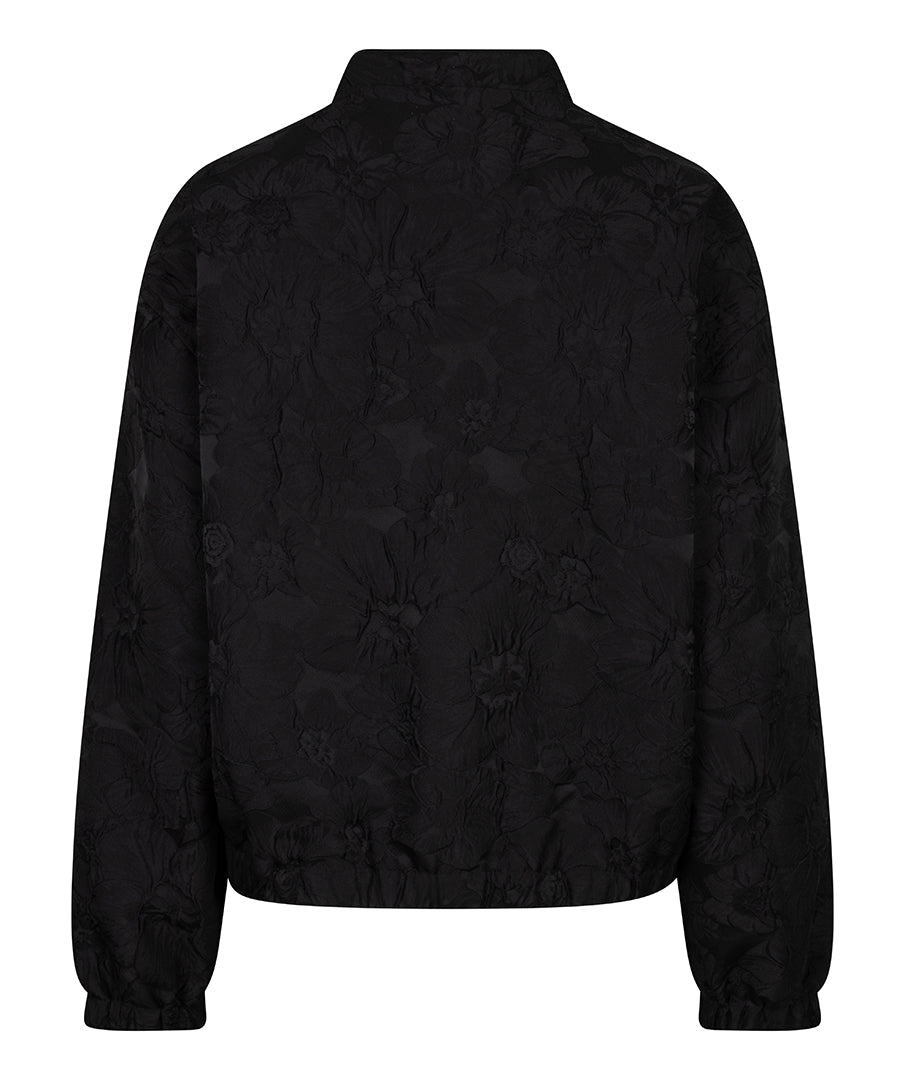 A black cropped jacket with a subtle tonal floral jacquard pattern, shown from the back against a plain white background.