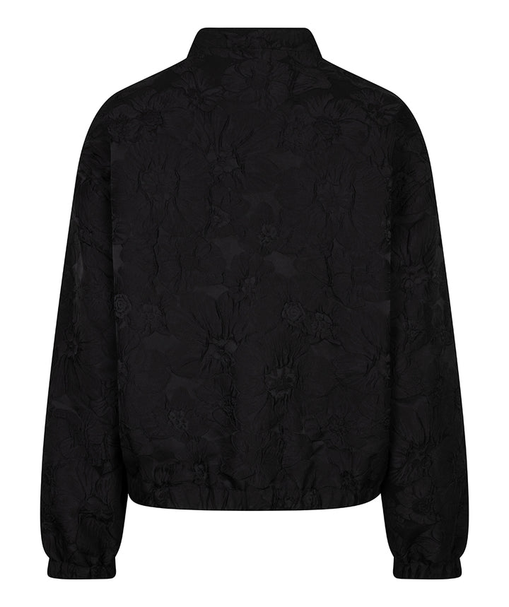 A black cropped jacket with a subtle tonal floral jacquard pattern, shown from the back against a plain white background.