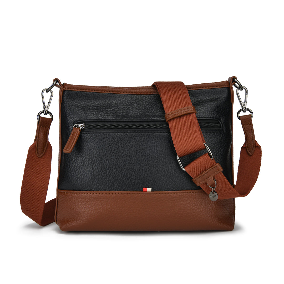 A two-tone leather crossbody bag with a black pebbled front panel and warm brown leather trim, featuring a matching brown adjustable shoulder strap with silver-tone hardware.