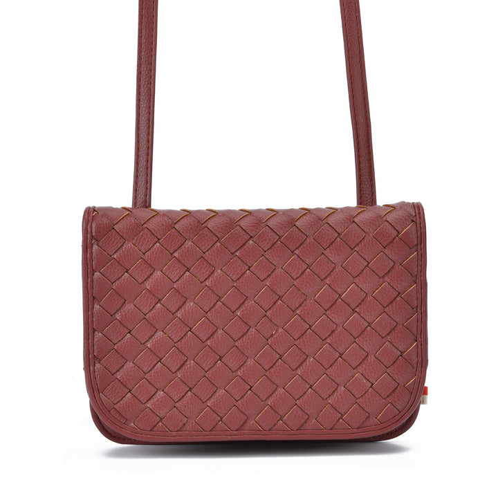A woven leather shoulder bag in a dusty rose or mauve-brown shade, featuring a diamond-weave pattern and a single shoulder strap, shown against a plain white background.