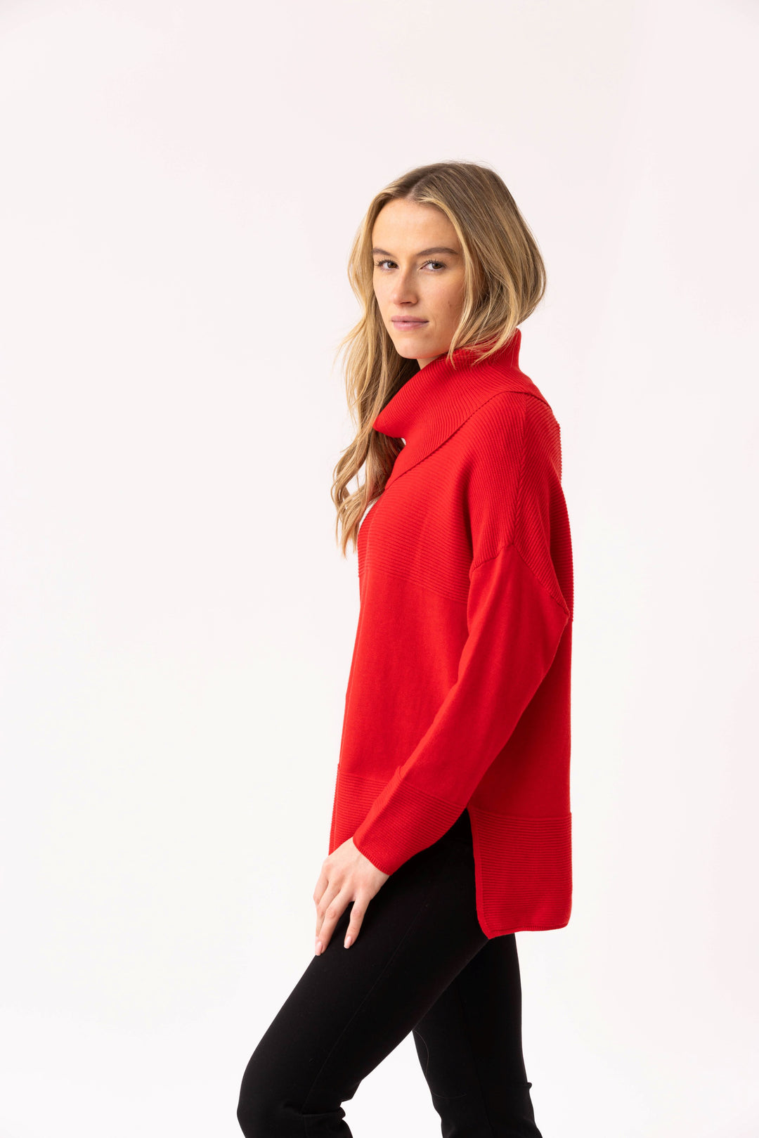 Woman wearing a red coat on a white background