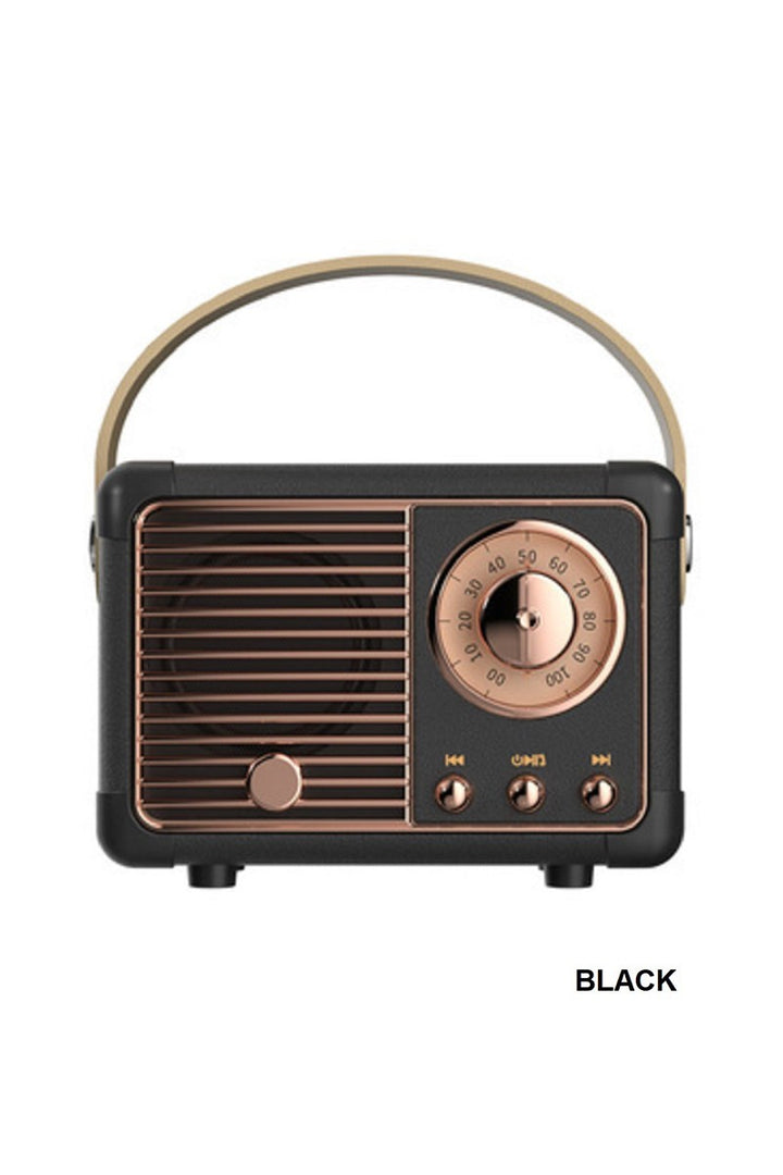 Vintage-style radio with black and bronze design on a white background