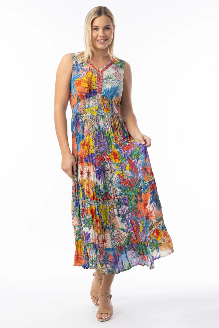 Woman wearing a colorful floral dress on a white background