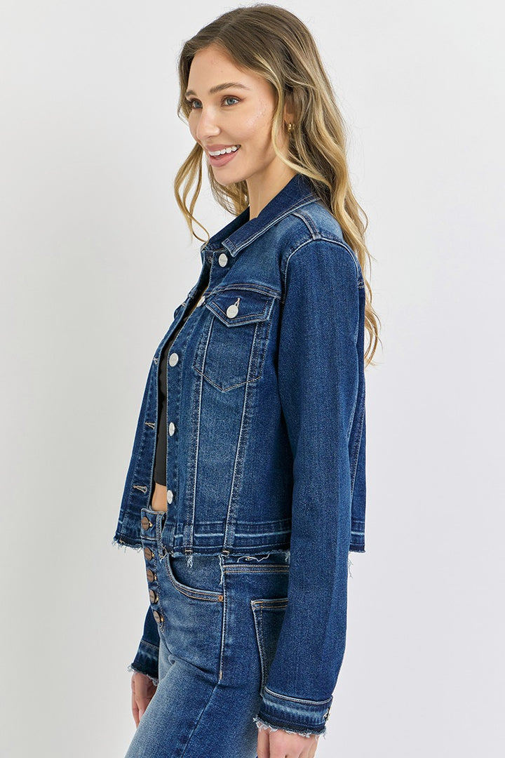 Woman wearing a blue denim jacket on a white background
