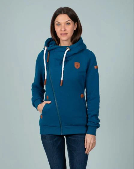 Woman wearing a blue hoodie with a logo on a gray background