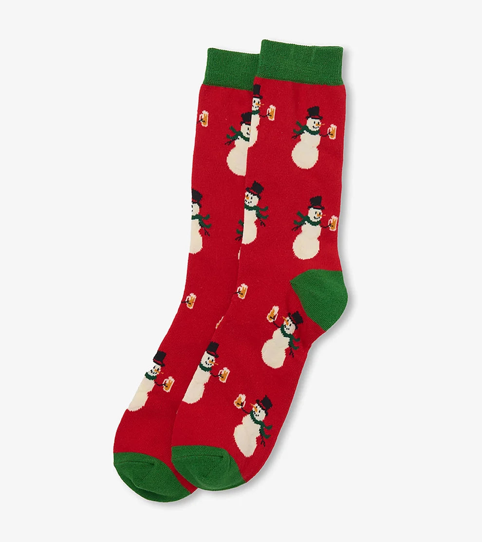 A pair of red crew socks with green cuffs, heels, and toes, featuring a repeating pattern of snowmen holding small red gift boxes, shown on a light gray background.