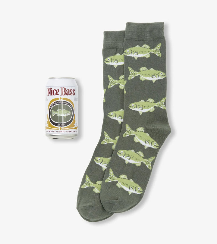 Green socks with fish pattern and a can of &