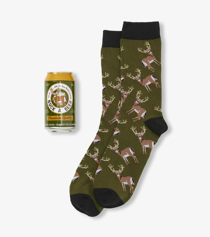 Green sock with deer pattern and a can of beer on a white background