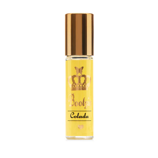 Yellow rollerball bottle with gold cap labeled 'Booty Colada' on a white background