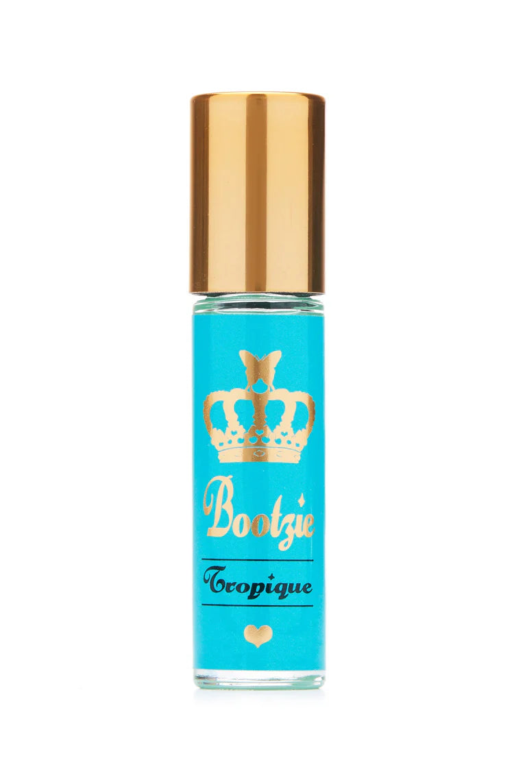 Perfume bottle with gold cap and turquoise label featuring &