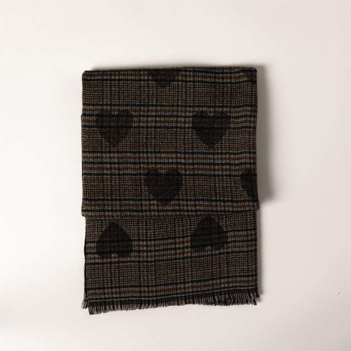 A folded plaid scarf in black and brown with a repeating heart pattern, displayed on a clean white background.