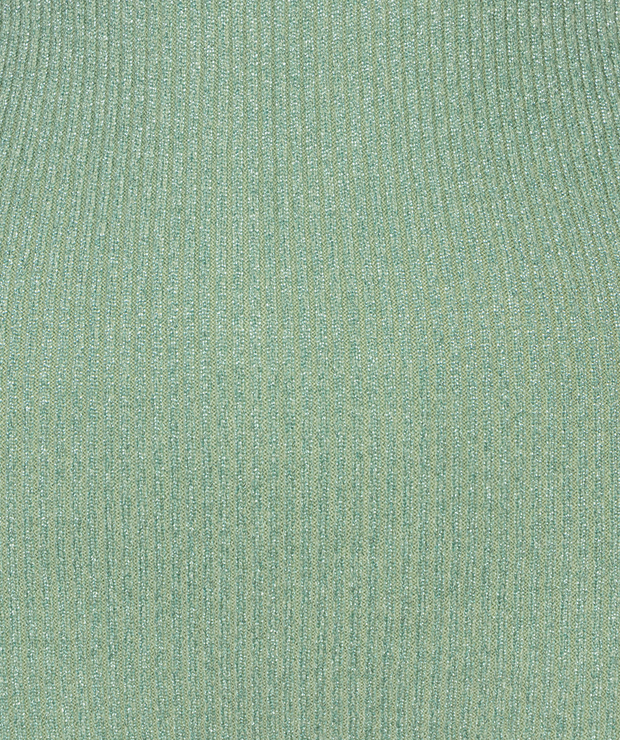 Close-up of a textured green fabric surface