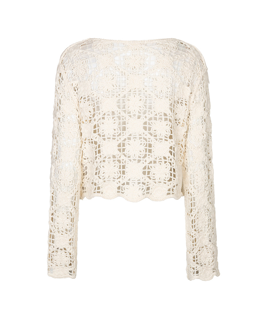 White crochet top on a white background