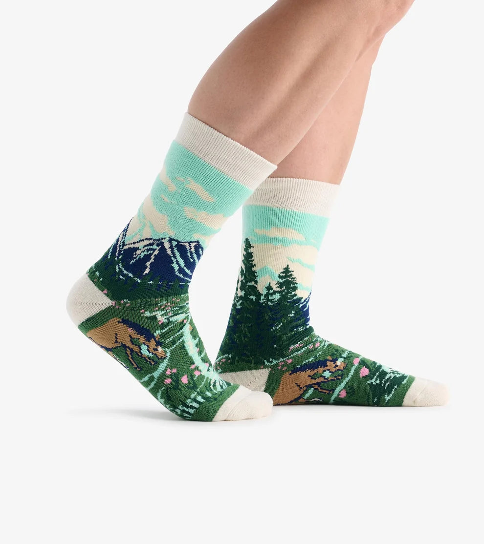 Pair of socks with nature-themed design on a white background
