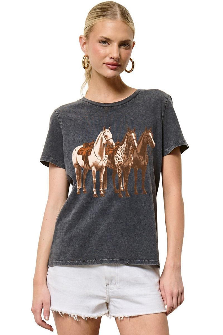 Woman wearing a t-shirt with horse graphics on a white background