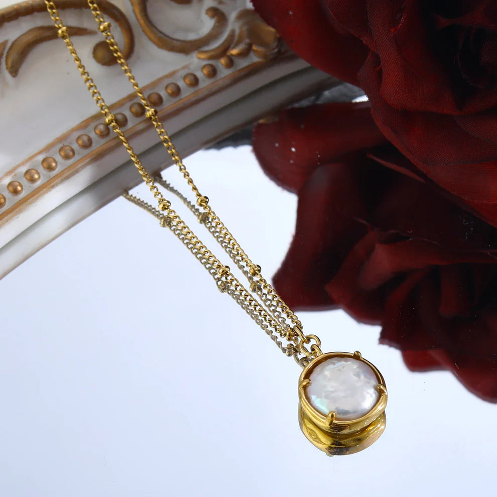 Oyester Beaded Chain with an Encased Fresh Water Pearl Pendant