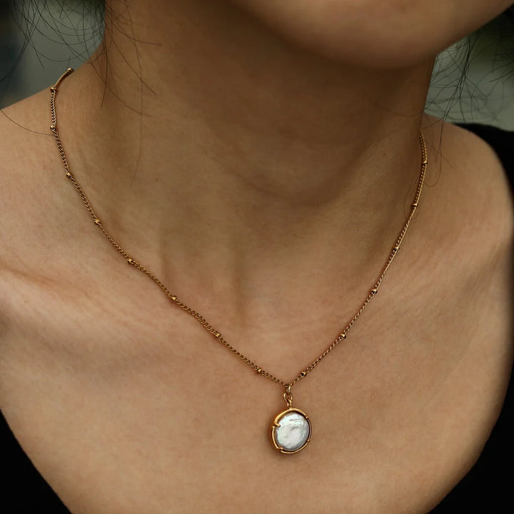 Oyester Beaded Chain with an Encased Fresh Water Pearl Pendant