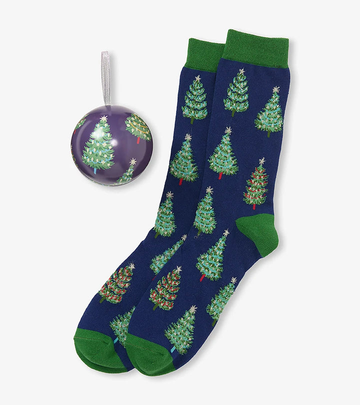 Navy socks with Christmas tree pattern and matching ornament on a white background