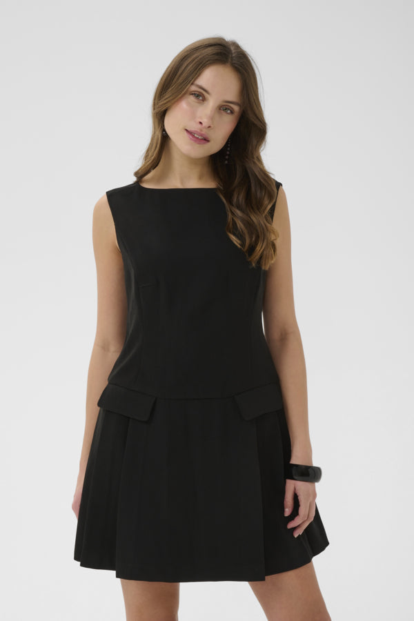 Woman wearing a black sleeveless dress on a white background