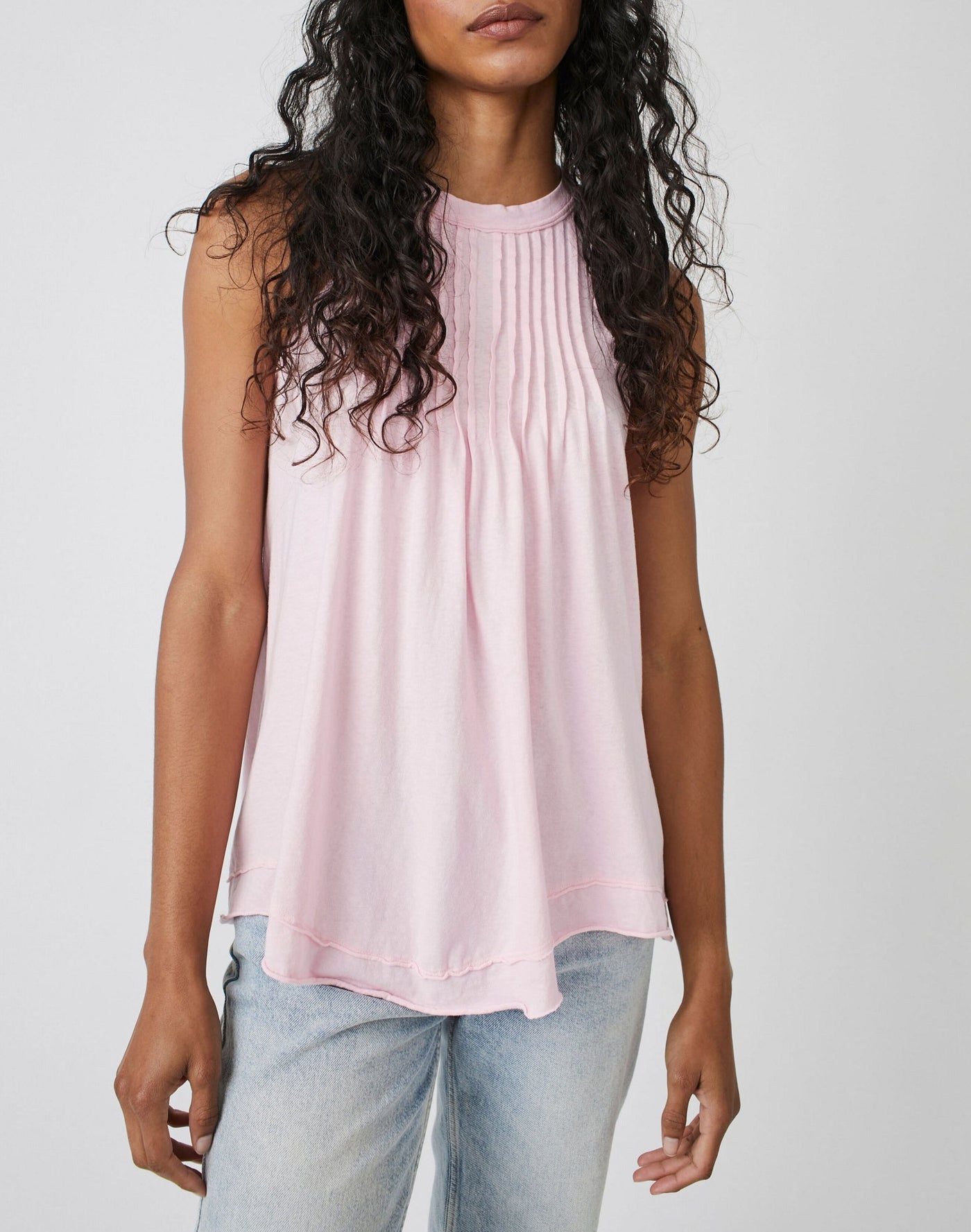 Pleated Tank // Pink Lemon This high-necked Pleated Tank in Pink Lemon is both effortless and essential. Wear it with your laidback look, or layer it up to build an outfit. Its relaxed, slouchy fit features pleating at the bust and dropped armholes, while subtle distressing at the hems complete the timeless, lived-in look. Embrace effortless style with this versatile and cool classic tank.   Hand Wash Cold  Measurements for size small Bust: 41 in Length: 28 in  Contents 100% Cotton
