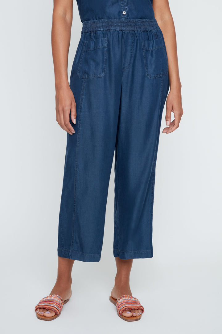 Person wearing a blue jumpsuit on a white background