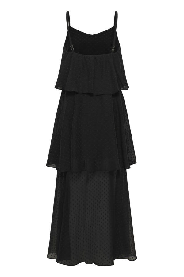 A black tiered maxi dress with thin shoulder straps and a subtle polka dot pattern, shown against a plain white background.