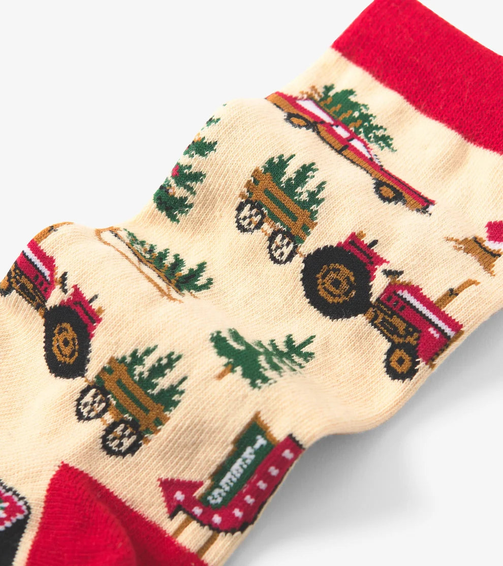 Sock with tractor and tree pattern on a white background