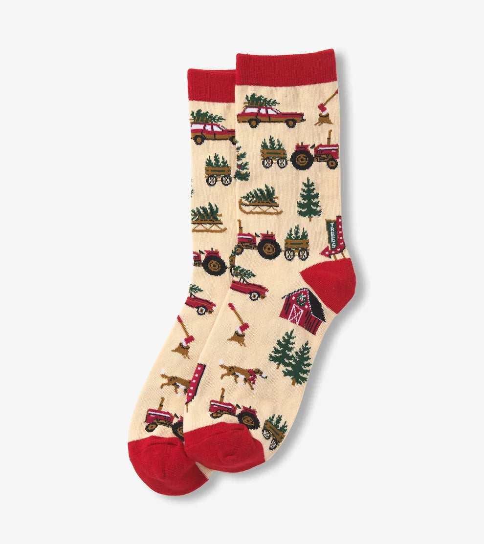 Pair of socks with farm-themed design on a beige background