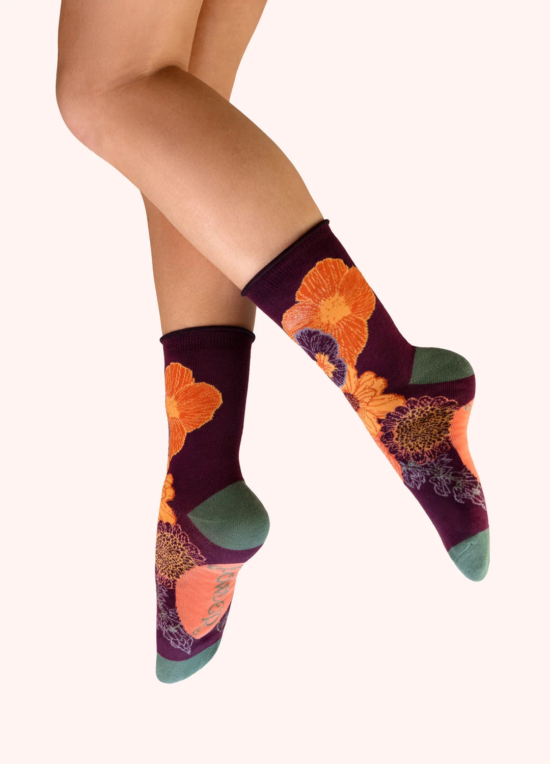 Colorful floral-patterned socks on a white background