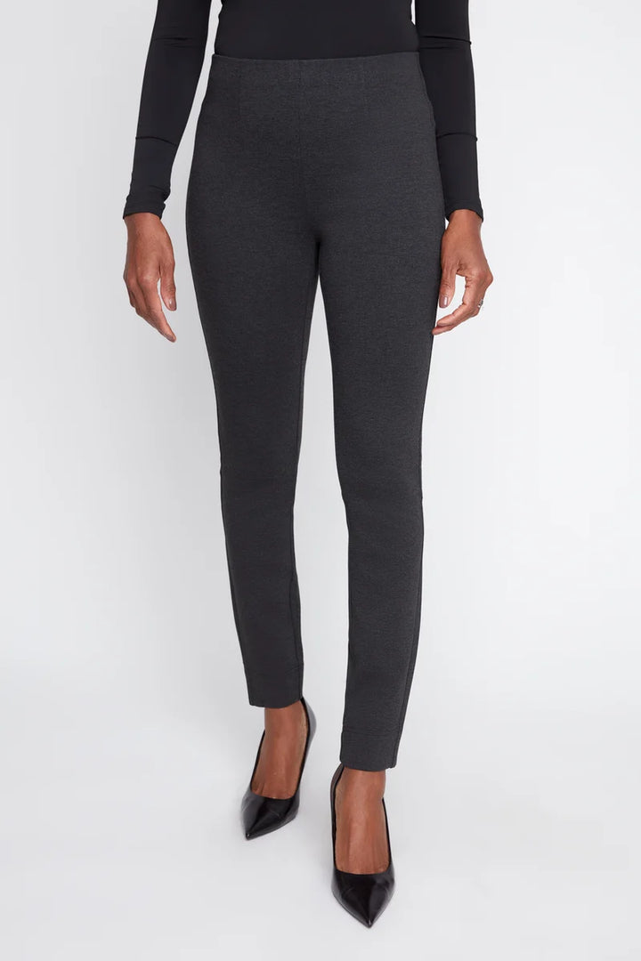 Dark gray leggings worn by a person on a white background