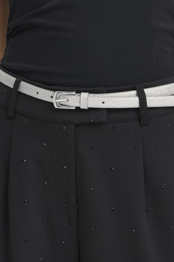 Black dress with a silver belt