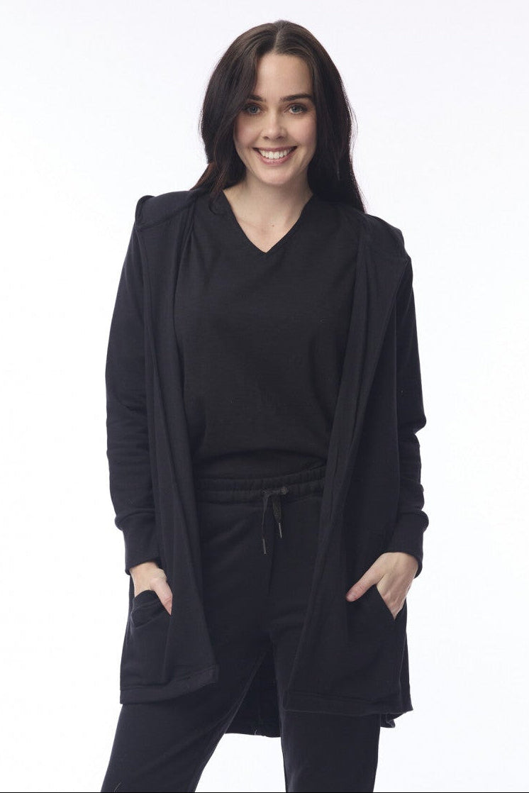 Person wearing a black outfit with a white background