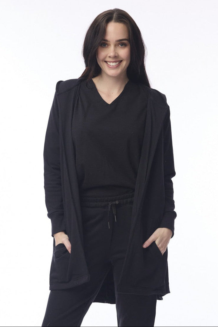 Person wearing a black outfit with a white background