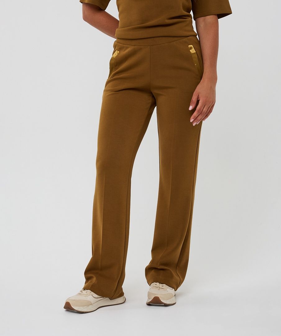 Brown outfit with pants and a top on a white background