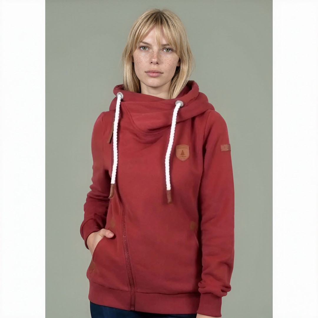 Red hoodie with white drawstrings worn by a person on a plain background