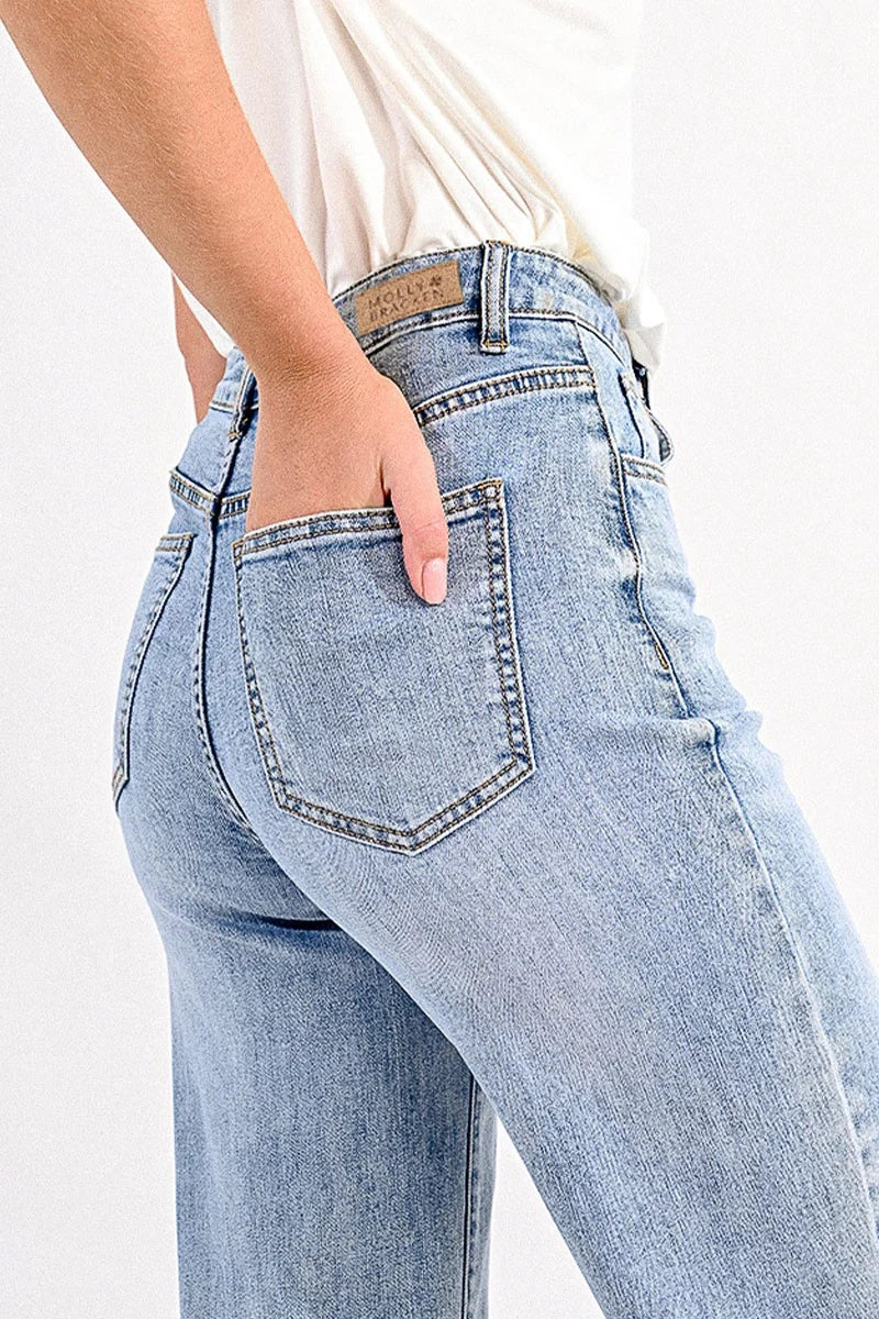 Light blue jeans with a brand logo on a white background