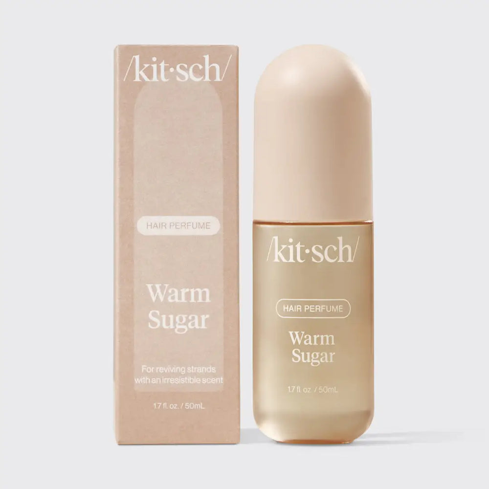 Kit-sch Warm Sugar hair perfume bottle and packaging on a light gray background