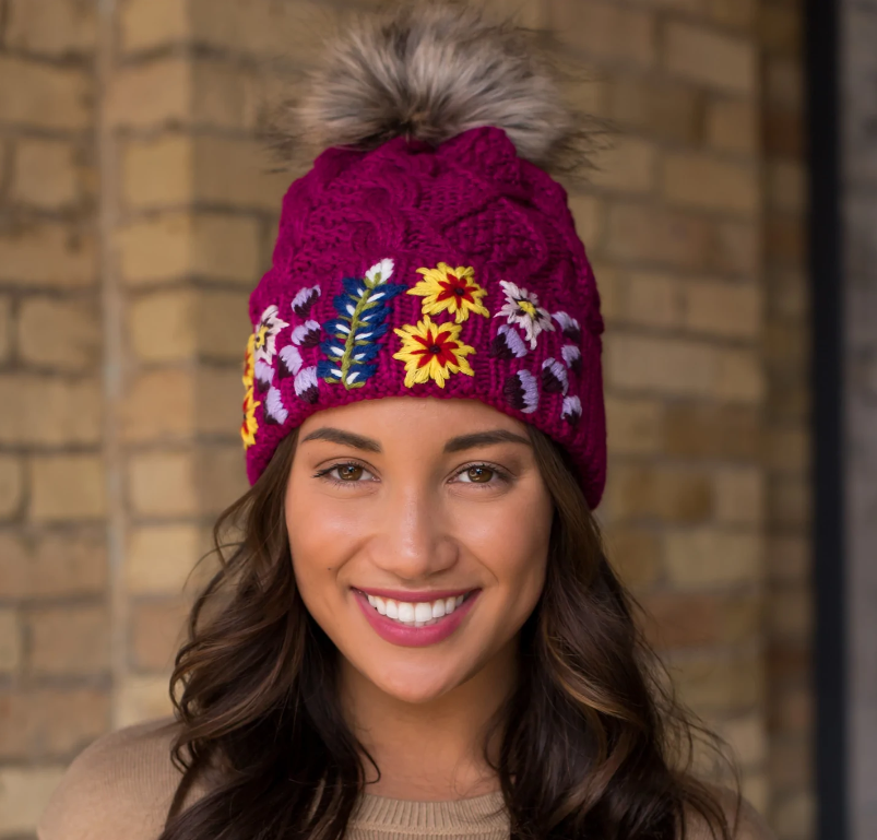 Magenta cable knit hat with hand stitched floral pattern