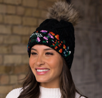 Black cable knit hat with hand stitched floral pattern